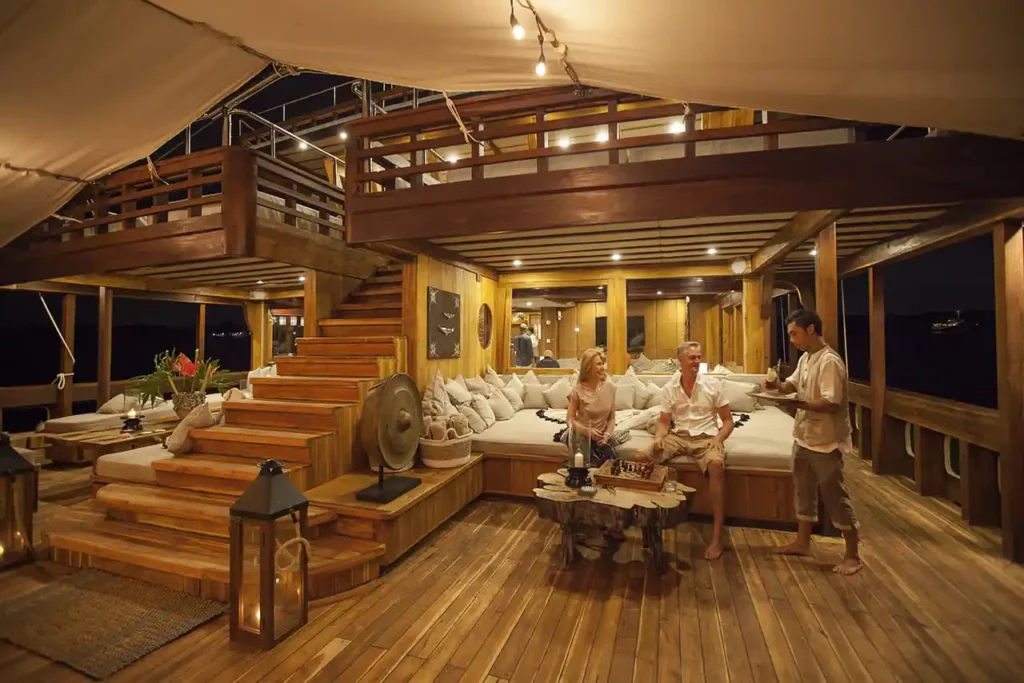 Guest Enjoying Moment in Yacht Komodo | Private Yacht Charter Komodo | Komodo Luxury