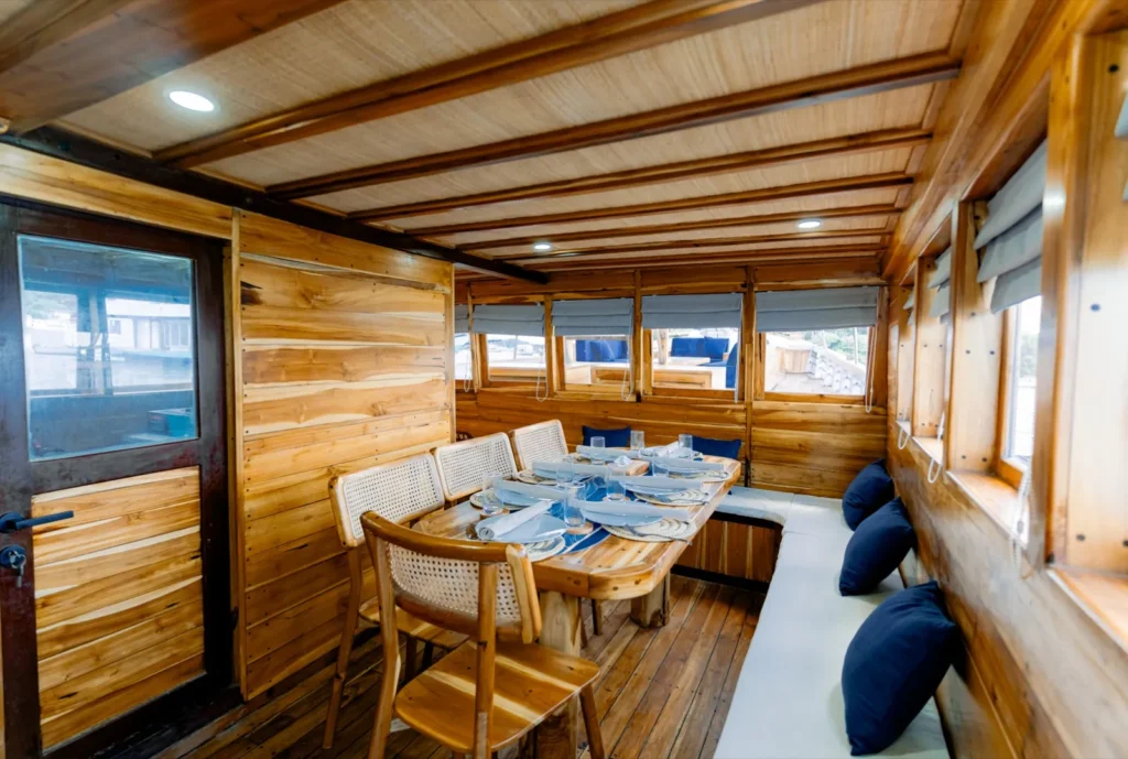 Indoor Dining Area in Barakati Phinisi | Komodo Island tour | Komodo Luxury