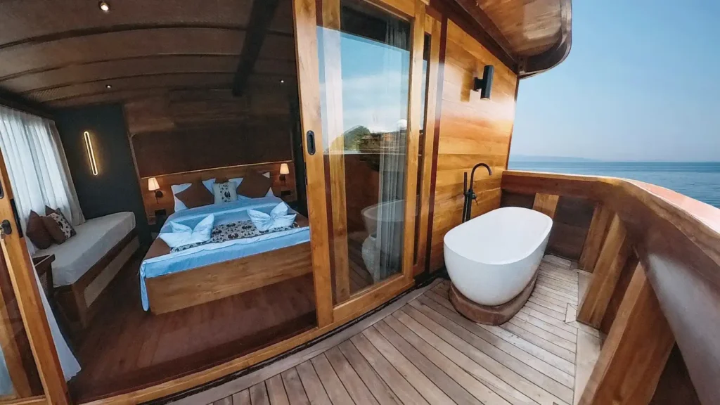 Angelica Liveaboard Phinisi Boat Charter | Candi Cabin Room Balcony | Komodo Luxury