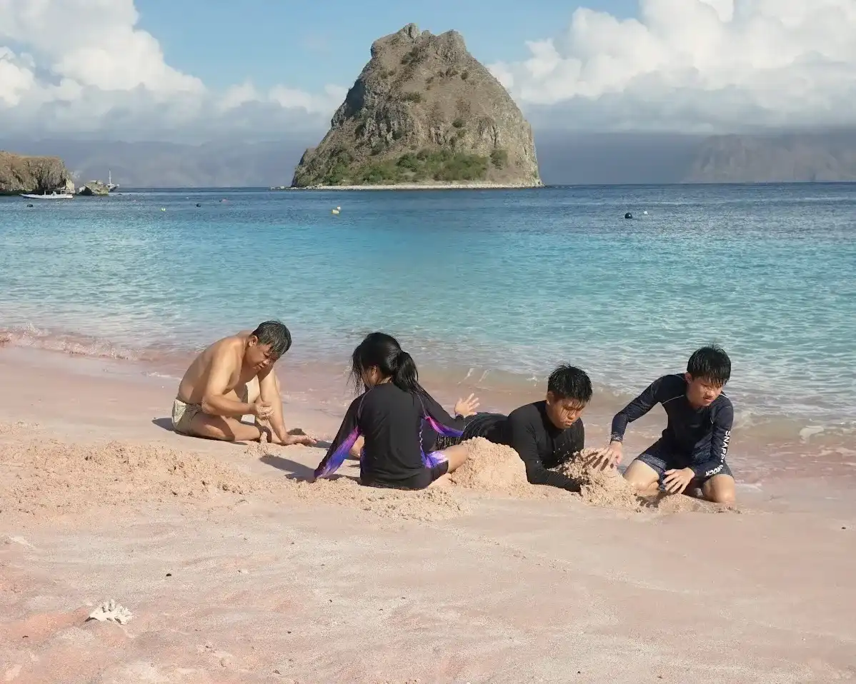 Families on the pink sand