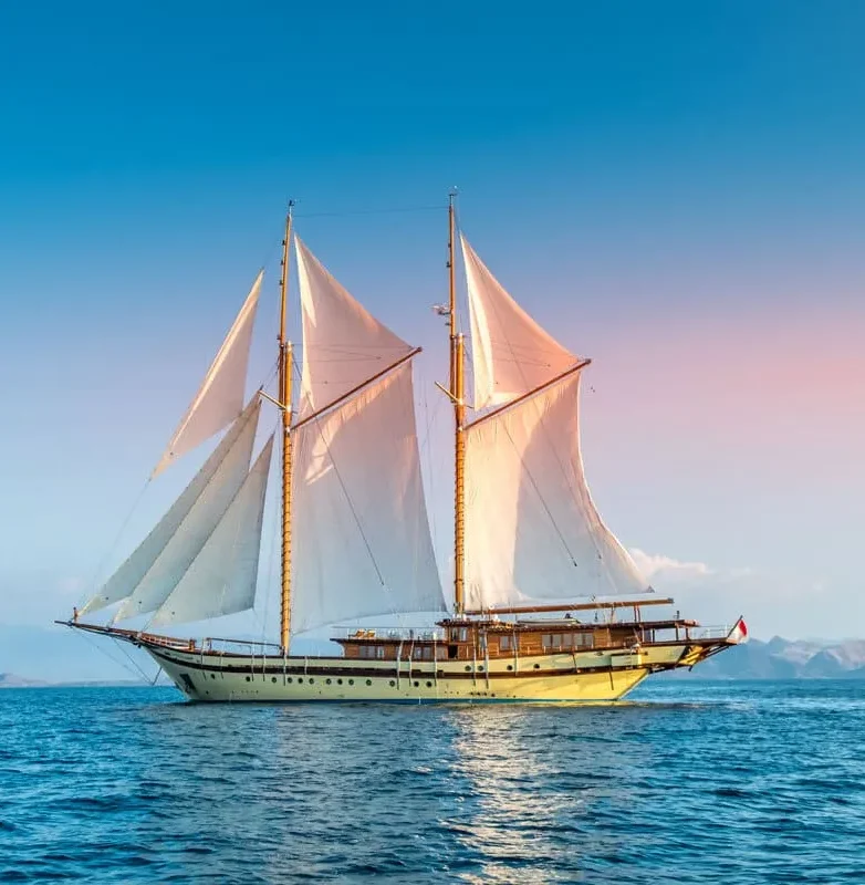 Boat sailing at sunset in Komodo National Park
