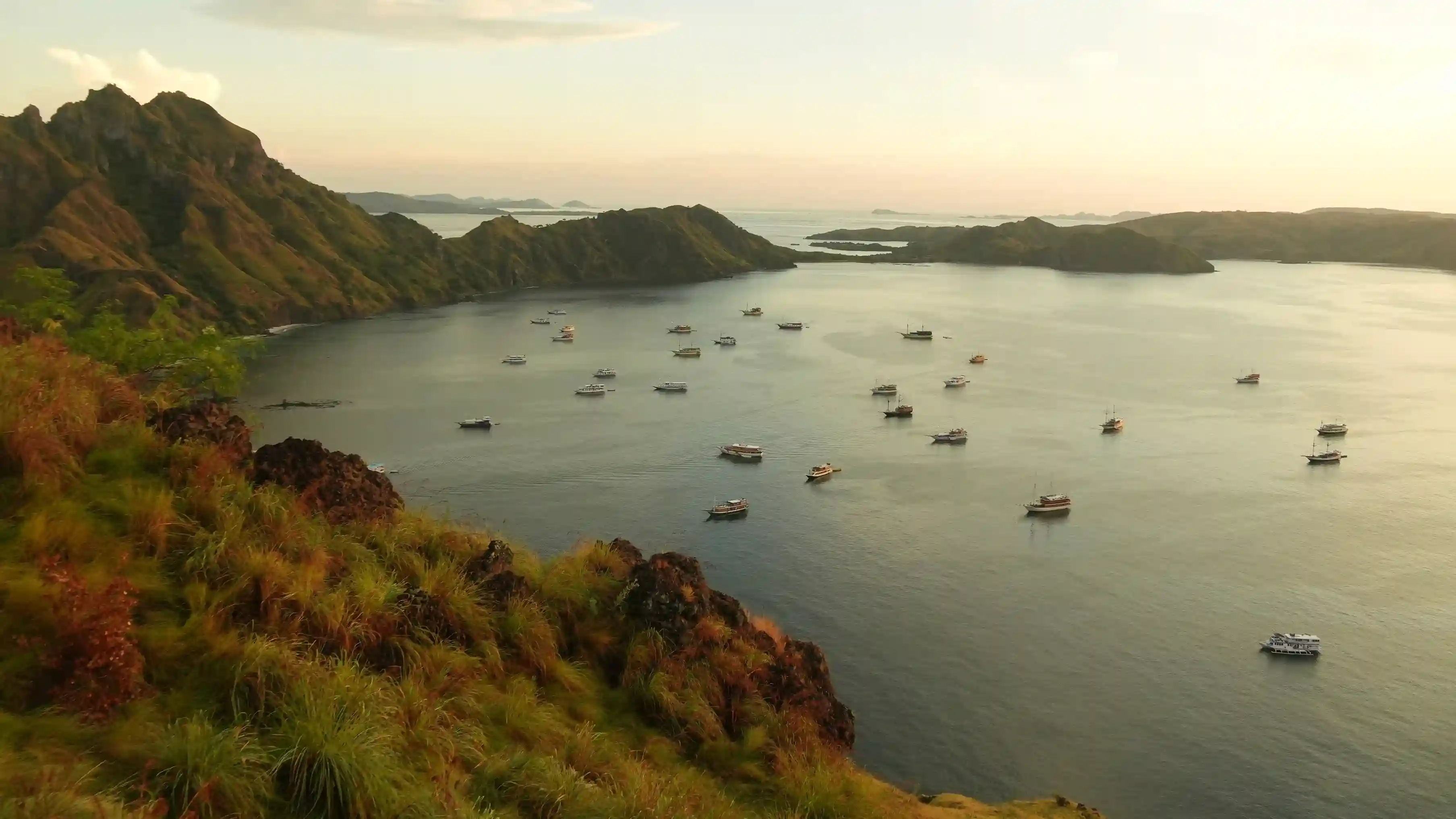 A Phinisi liveaboard under way in Komodo National Park