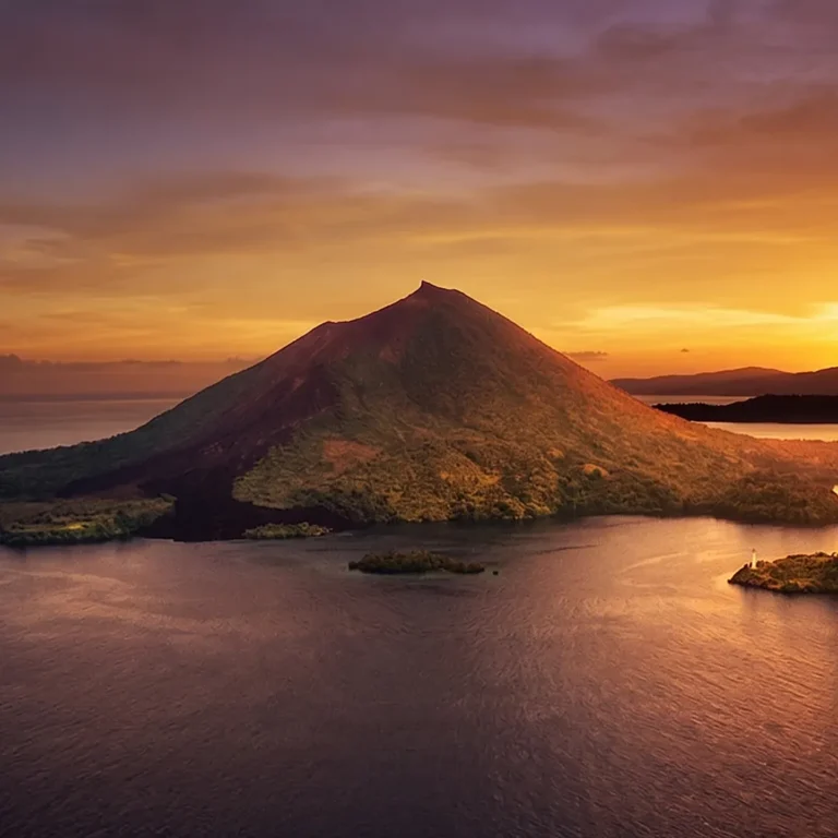 The volcano of Banda at sunset, seen across the water